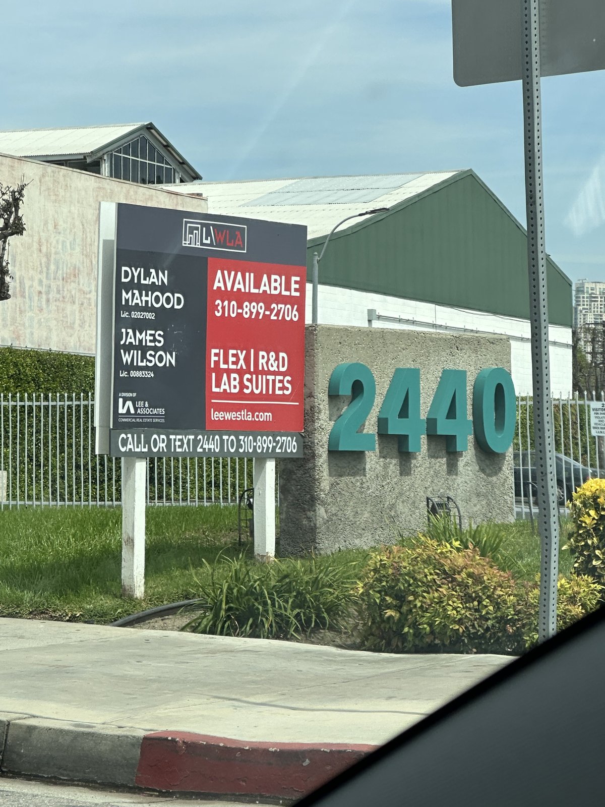 Lee & Associates West LA commercial real estate property sign at 2440 Sepulveda with CALL OR TEXT 2440 TO 310-899-2706 invitation